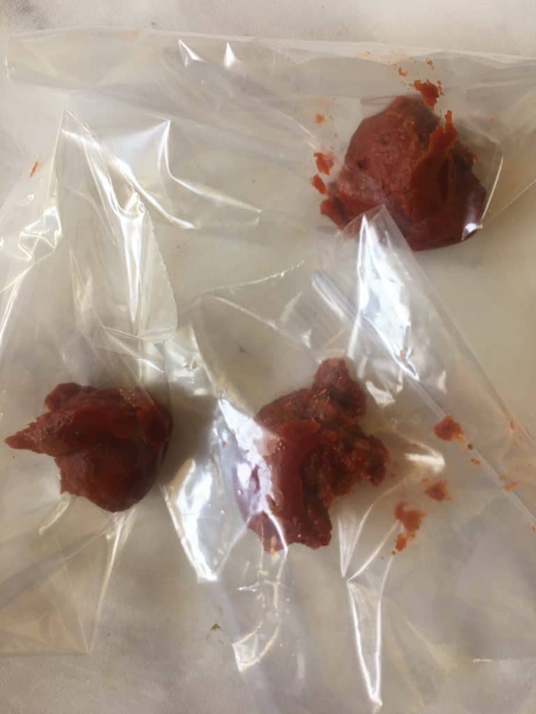 Leftover Tomato Paste portioned out and ready to freeze