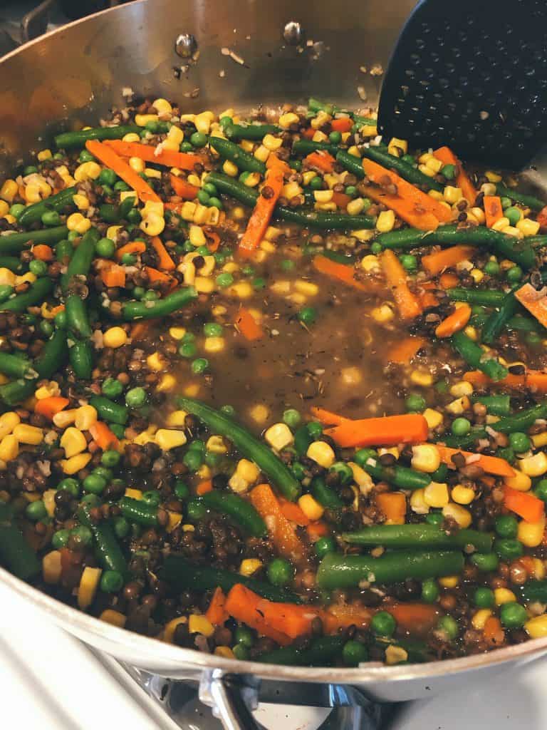 vegetables and lentils in a pan