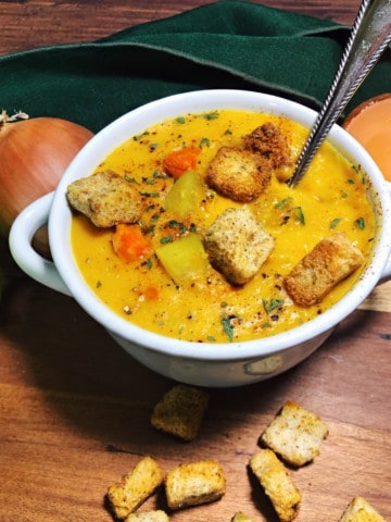 coconut curry butternut squash soup in a white soup bowl