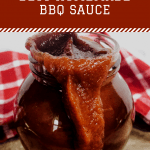 BBq sauce in glass jar with red checkered cloth