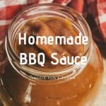 Bbq sauce in jar with red checkered cloth