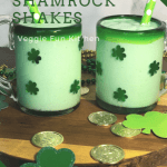 two shamrock shakes in glasses with green polkadot straws