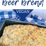 savory garlic herb beer bread in loaf pan on blue checkered cloth