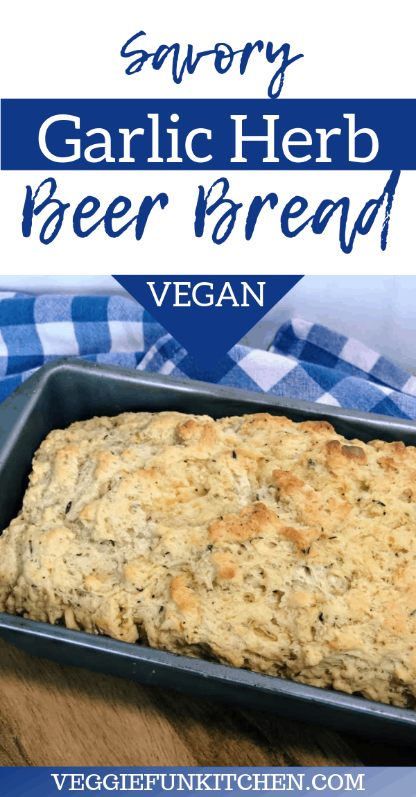 savory garlic herb beer bread in loaf pan on blue checkered cloth