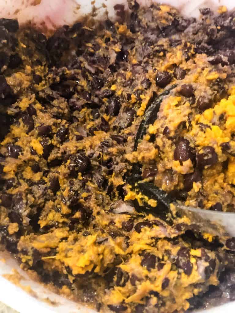sweet potatoes and black beans mashed in a bowl
