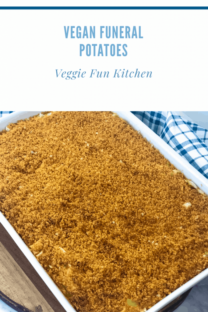 vegan funeral potatoes in white casserole dish with blue checked napkin