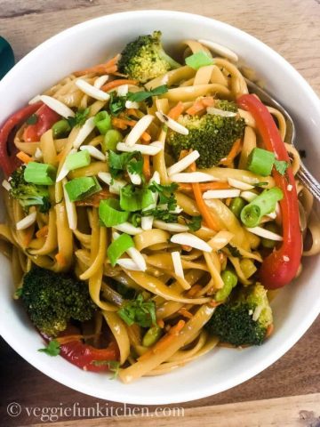 asian noodle stir-fry in white bowl