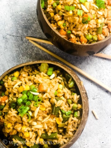 fried rice in two coconut bowls