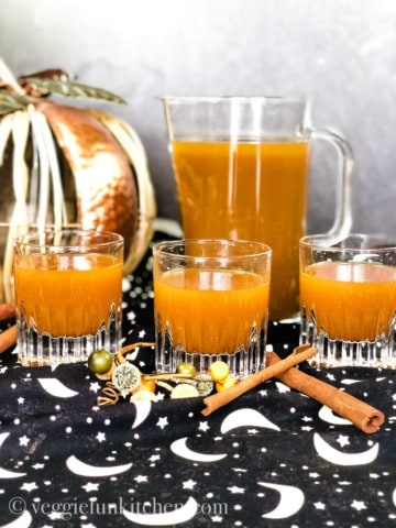 pumpkin drink in picture with three filled glasses