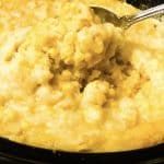 vegan corn casserole in crockpot spooned out