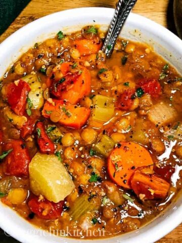 veggie lentil soup in white bowl