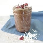 black forest cake smoothie in jar with blue napkin
