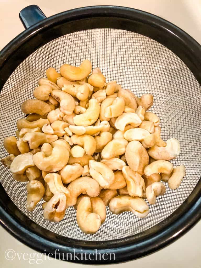 soaked and drained cashews in a a mesh strainer