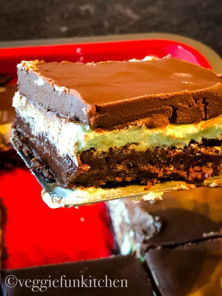 chocolate mint brownies cut in pan with one on spatula