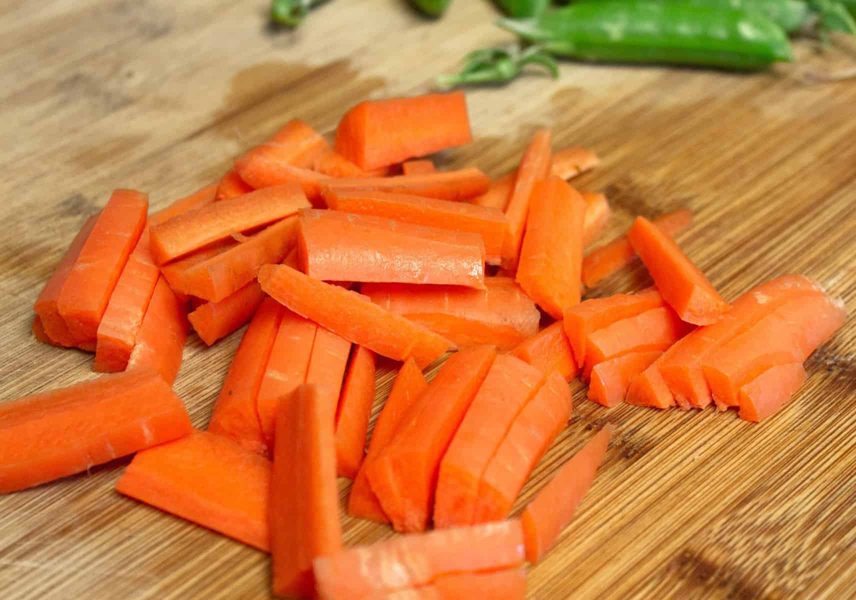 chopped carrots on wooden cutting board