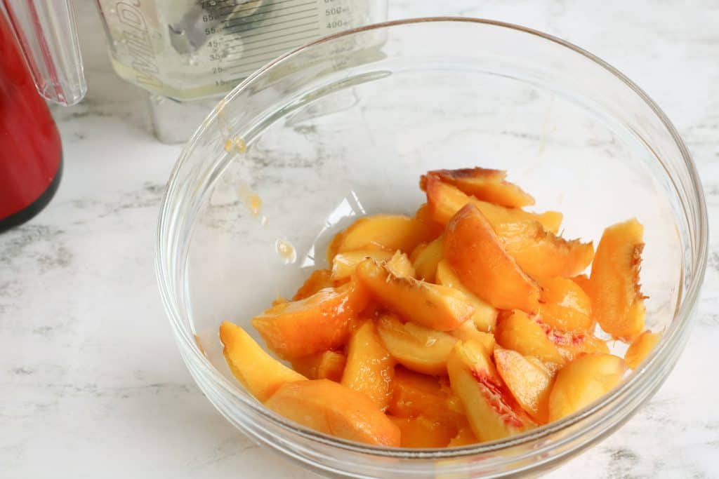 cut peaches in a glass bowl
