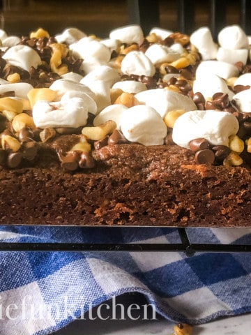 uncut and out of pan, rocky road brownies on cooling rack