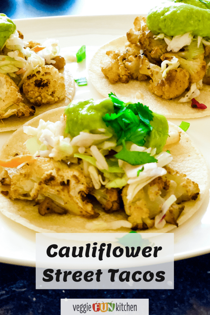 Three cauliflower street tacos on white plate with pinterest text overlay