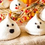 decorated ghostly vegan meringues on burlap