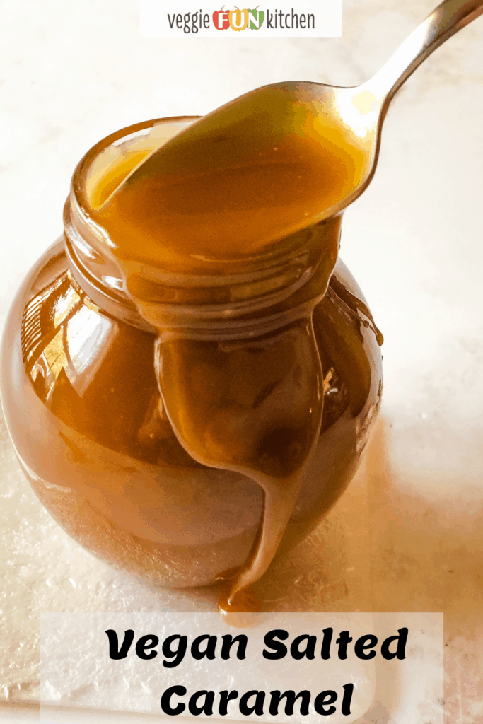 small jar of caramel sauce with spoon dipping in to scoop some out with pinterest text overlay