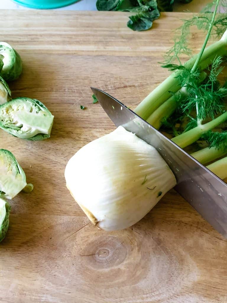 cutting the stalks off from fennel bulb