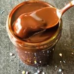 spoon dipping out portion of chocolate sauce