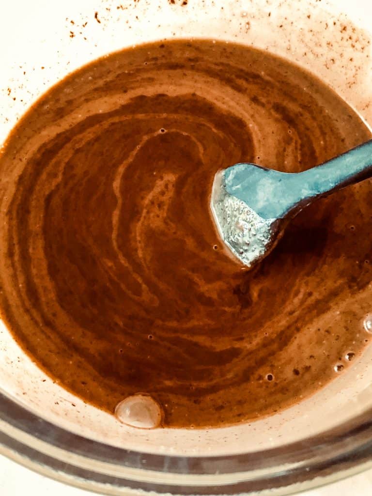 staring the melted chocolate into the hot coconut cream
