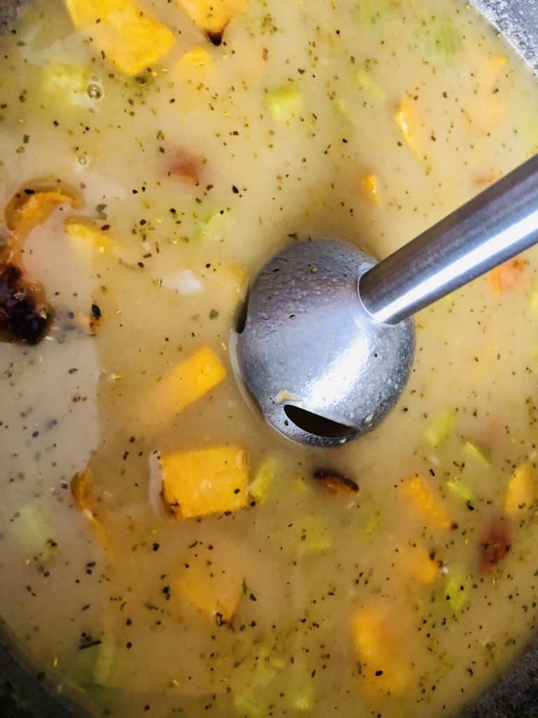 immersion blender blending the roasted butternut squash soup