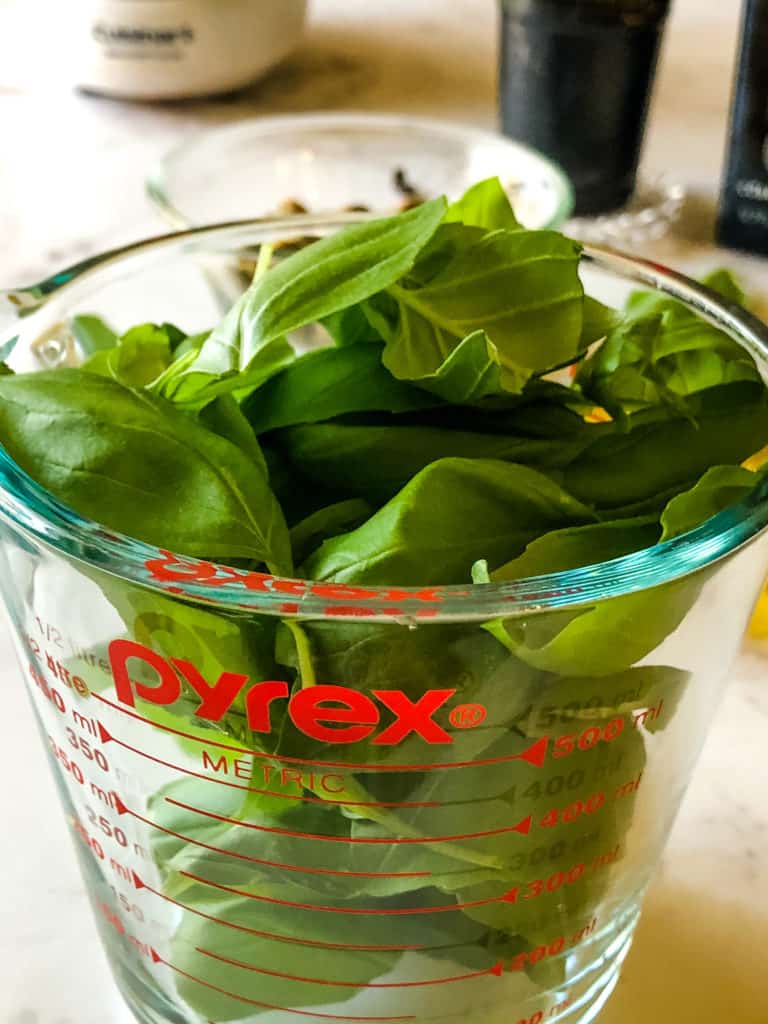 heaping two cups of fresh basil leaves