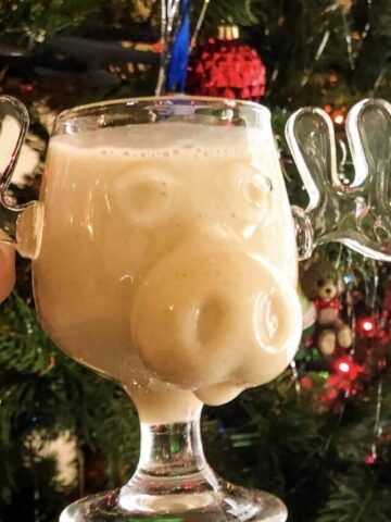 egan eggnot in a moose cup against a christmas tree background
