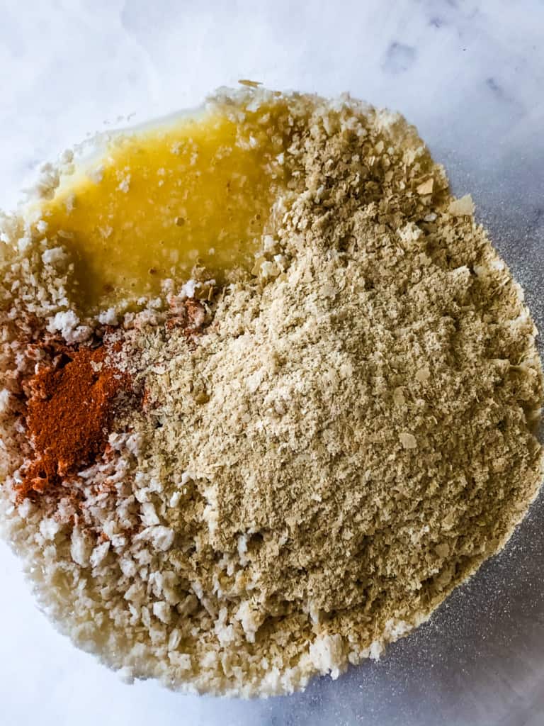 ingredients for crumb topping including panko bread crumbs, nutritional yeast, paprika, and melted vegan butter