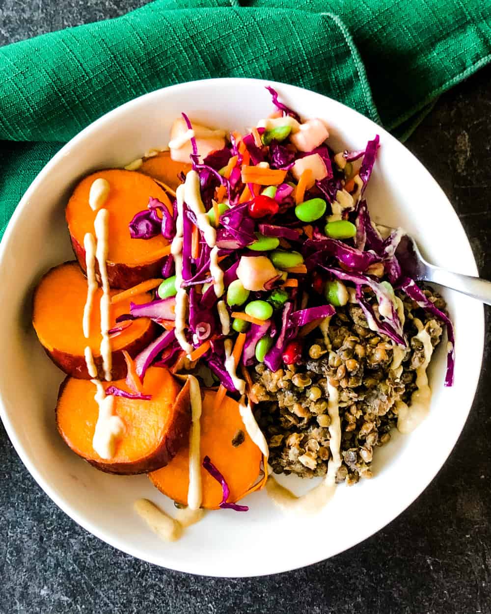buddha bowl with purple cabbage slaw, sweet potatoes, and lentils