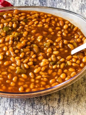 clear serving bowl of BBQ baked beans