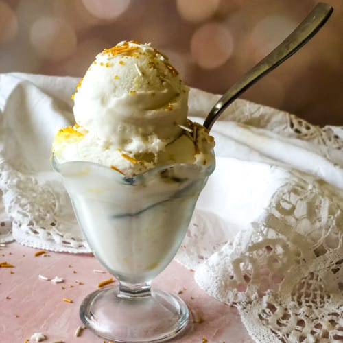 ice cream dish with lemon ice cream topped with sprinkles