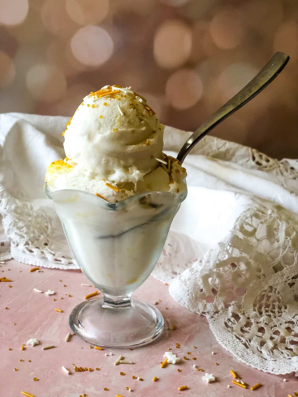 ice cream dish with lemon ice cream topped with sprinkles