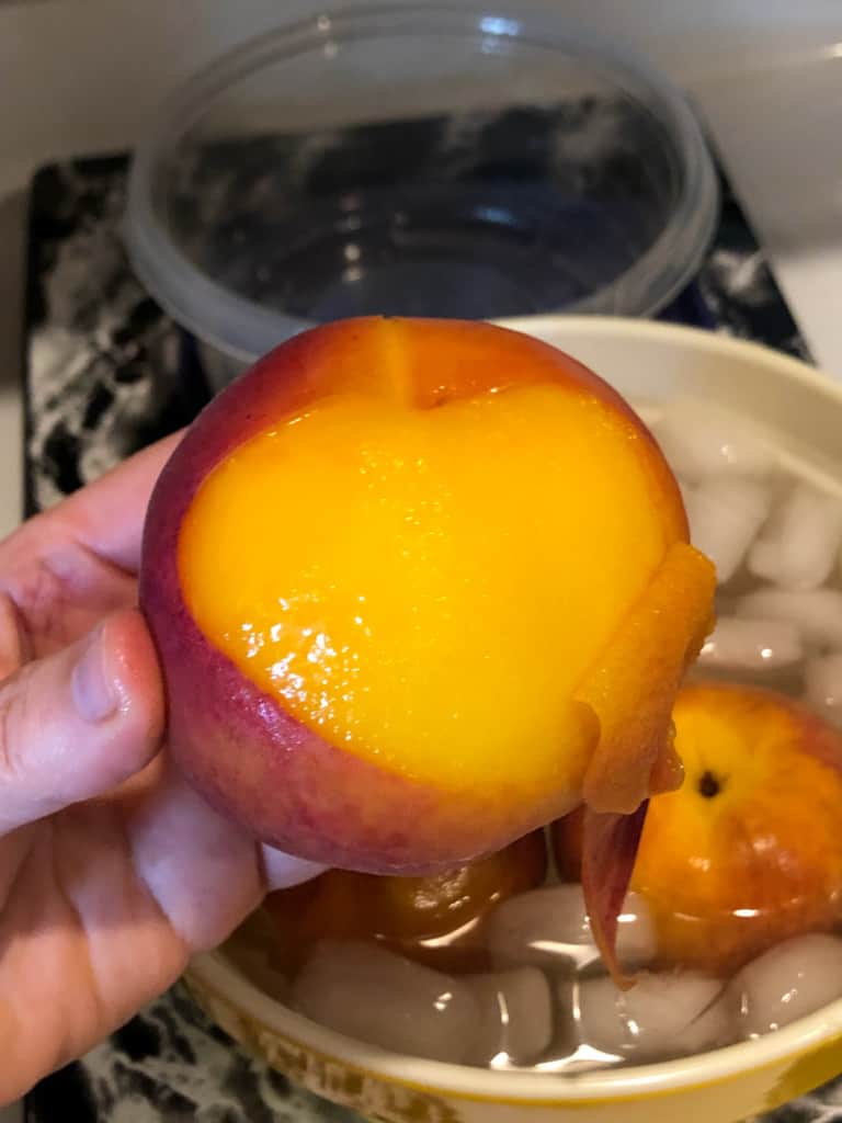 Showing how a peach easily peels