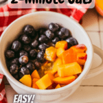 bowl of cooked oatmeal topped with blueberries and peaches with pinterest text overlay