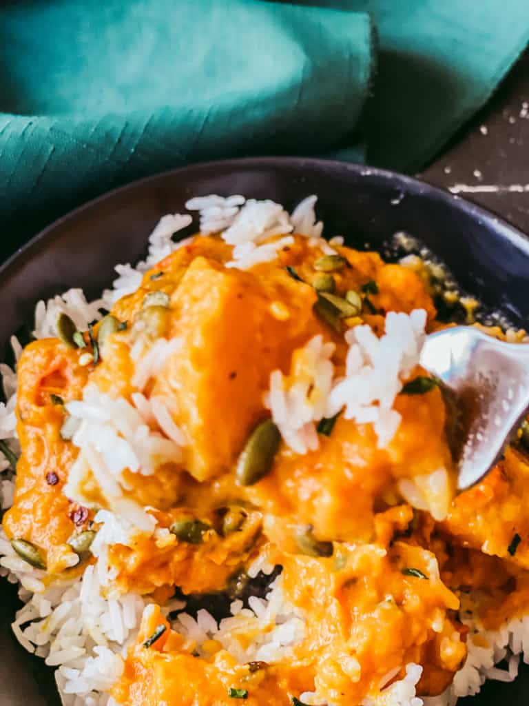butternut squash sauce on fork with rice