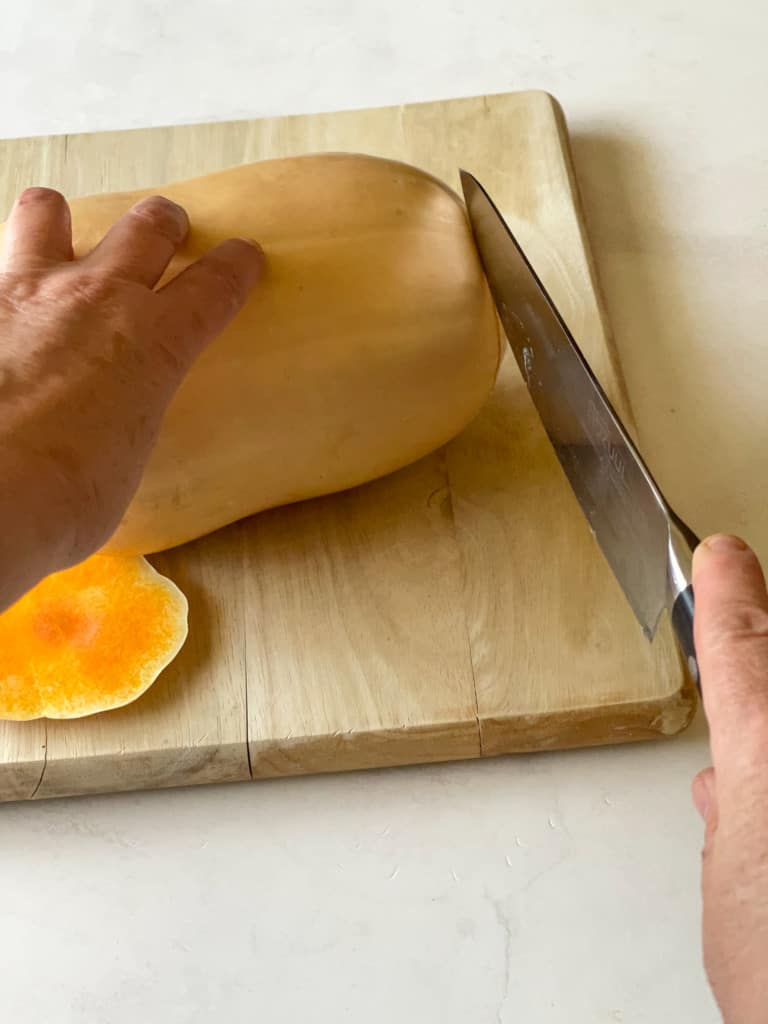 slicing the ends off the butternut squash