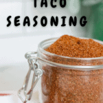 glass jar of homemade taco seasoning with pinterest text overlay