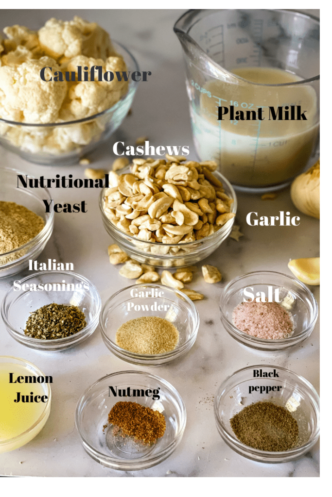 Ingredients needed for vegan Alfredo including cauliflower, plant milk, cashews, nutritional yeast, Italian Seasonings, onion powder, garlic, salt, lemon juice, nutmeg, black pepper