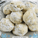 plate of pecan snowball cookies with pinterest text overlay and blue snowflake graphics