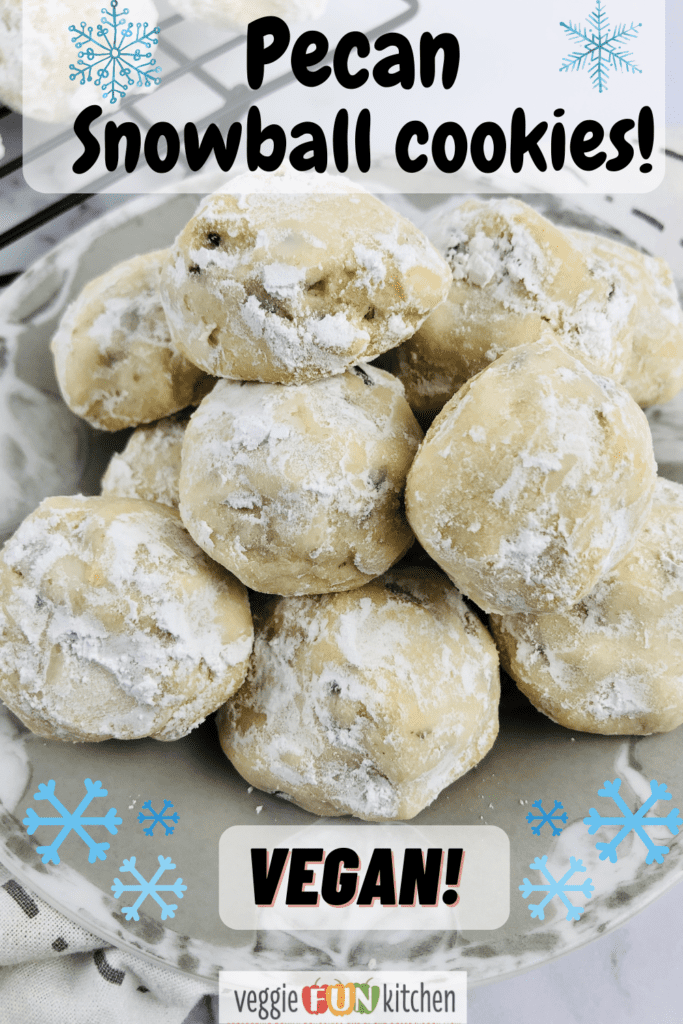 plate of pecan snowball cookies with pinterest text overlay and blue snowflake graphics