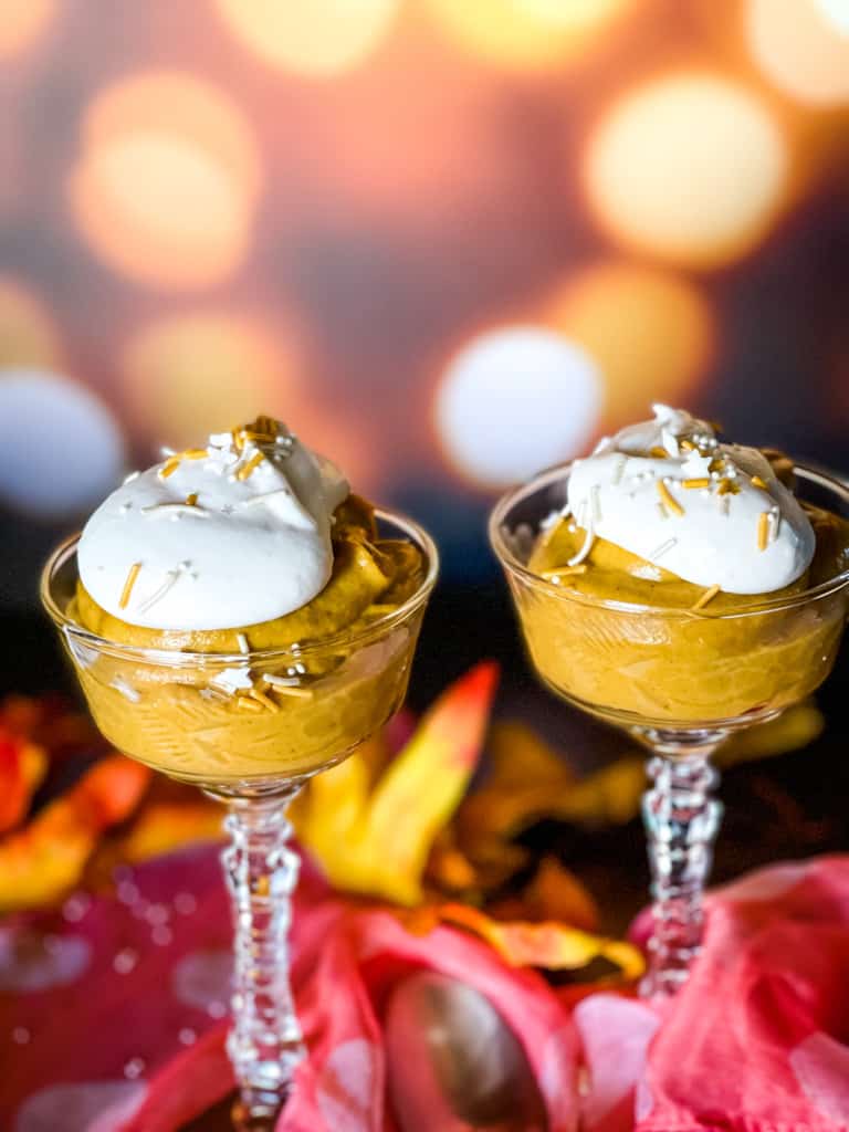 two stemmed crystal dishes with pumpkin mousse