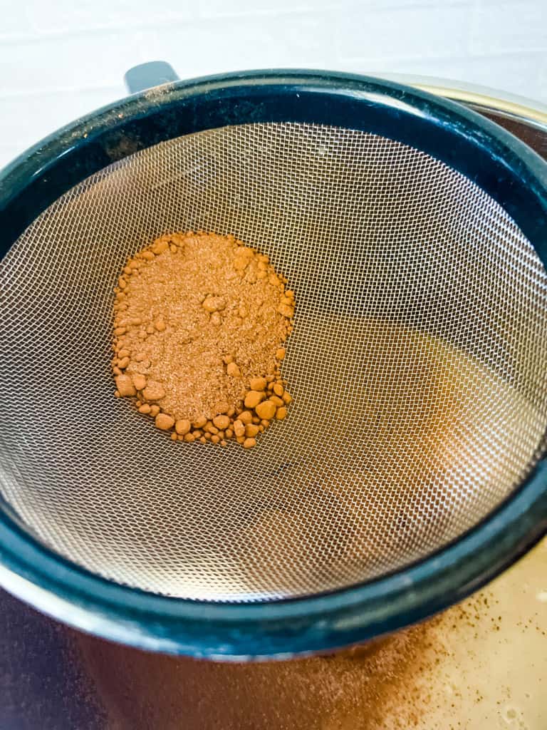 little balls of cocoa powder that need to be pushed through the sieve