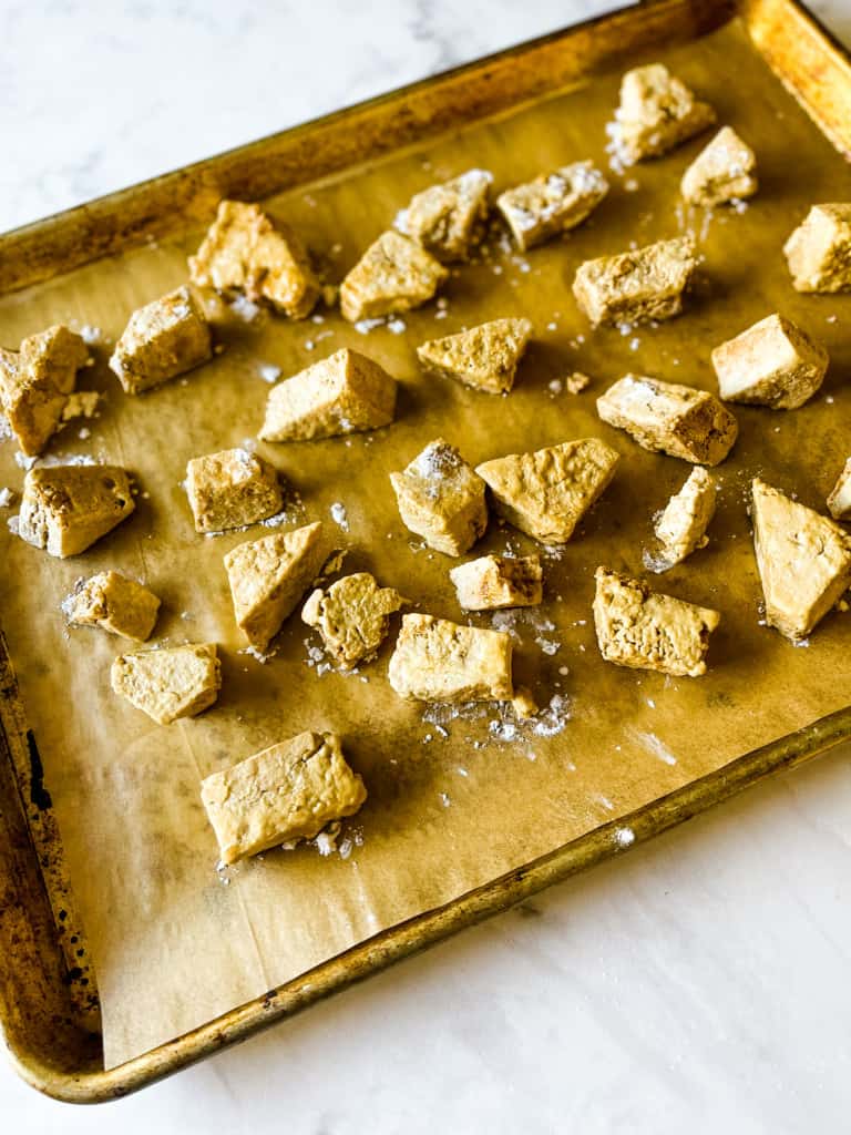tofu on a baking sheet prepared and ready to be baked