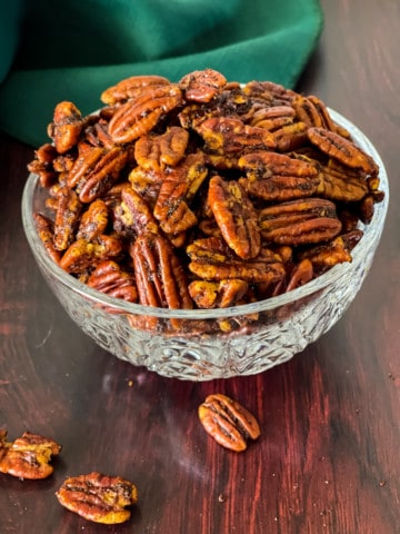 savory spiced pecans in crystal bowl