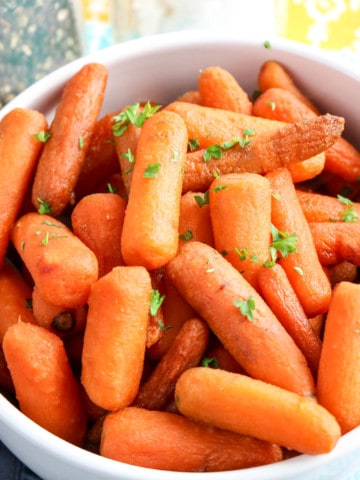 Dish of buttery brown sugar carrots sprinkled with thyme