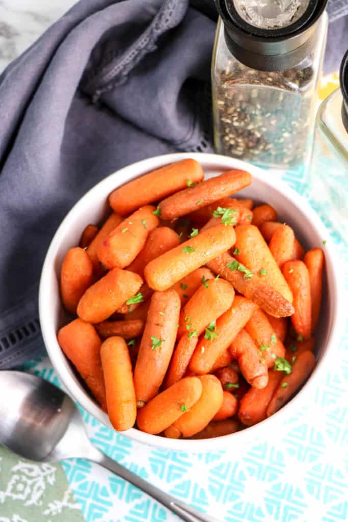 Dish of buttery brown sugar carrots sprinkled with thyme