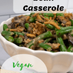cooked green bean casserole in white casserole dish with pinterest text overlay